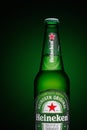 Minsk, Belarus - May 10, 2020 : Bottle of Heineken Lager Beer on green background Royalty Free Stock Photo