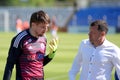 MINSK, BELARUS - MAY 6, 2018: Goalkeeper Gorbunov talks with coach Sergei Gurenko after the Belarusian Premier League