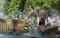 Minsk, Belarus - May 9, 2018 Handsome men with naked torso in the fountain. Splashes, good mood. Victory Day .