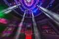 MINSK, BELARUS - MAY 2012: interior of stylish night disco club with neon blue violet light, disco mirror ball and bright