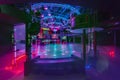 MINSK, BELARUS - MAY 2012: interior of stylish night disco club with neon blue violet light, disco mirror ball and bright