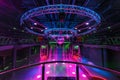 MINSK, BELARUS - MAY 2012: interior of stylish night disco club with neon blue violet light, disco mirror ball and bright