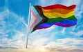 new Progress LGBTQ rainbow flag waving in the wind at cloudy sky. Freedom and love concept. Pride month. activism, community and