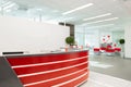 Minsk, Belarus - May 23, 2019: Reception area for visitors of modern office with red-white interior Royalty Free Stock Photo