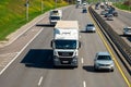 Minsk, Belarus - May 10, 2022: A road with heavy traffic in both directions. There is a large truck in the foreground. Frontal