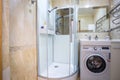 MINSK, BELARUS - MAY 2020: water tap sink with faucet in expensive loft bathroom. detail of a corner shower cabin with wall mount