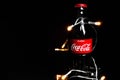 Minsk, Belarus - November 28, 2019: Coca-Cola Classic in a glass bottle Isolated on black Background with lights. Coca Royalty Free Stock Photo