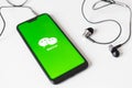 Minsk, Belarus - November 06, 2019: Smartphone launch Wechat application on the screen on the desk