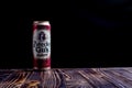 Minsk. Belarus. November 8, 2020. Studio lighting. wooden background in retro style. On it is a metal and sticky beer can. Close-