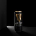 MINSK, BELARUS - OCTOBER 19, 2021: Alluminium can of Guinness original beer on black background. Guinness beer has been produced Royalty Free Stock Photo