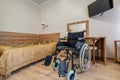 MINSK, BELARUS - OCTOBER 2020: Interior of the bedroom with wheelchair in apartments or hotel for people with disabilities,