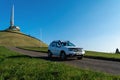 Minsk, Belarus-October 2021: Off-road white Renault Duster against the backdrop of the Mound of Glory. Autumn landscape. 4x4, SUV