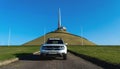 Minsk, Belarus-October 2021: Off-road white Renault Duster against the backdrop of the Mound of Glory. Autumn landscape. 4x4, SUV