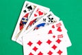 Poker full house playing card, green background Royalty Free Stock Photo