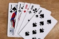 Poker full house playing card, wooden background Royalty Free Stock Photo