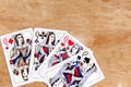 Poker quads playing card, wooden background