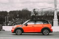 Minsk, Belarus. Orange Color Mini Cooper All 4 Car In Fast Motion On Street