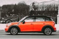 Minsk, Belarus. Orange Color Mini Cooper All 4 Car In Fast Motion On Street