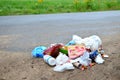 People throw away plastic bottles, bags and food waste, leave trash on the street after themselves. Royalty Free Stock Photo