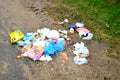 People throw away plastic bottles, bags and food waste, leave trash on the street after themselves Royalty Free Stock Photo