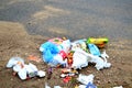 People throw away plastic bottles, bags and food waste, leave trash on the street after themselves. Royalty Free Stock Photo
