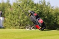 Minsk. Belarus - 25.07.2021 - Push-Pull Golf Carts. Green grass, trees.