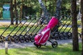 Minsk. Belarus - 24.07.2021 - Push-Pull Golf Carts. Green grass, trees.