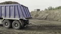 Minsk-Belarus, 18.11.2022: Scene. Construction in a quarry with cement transportation in a big blue lorry with high