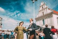 Minsk, Belarus. Couple of people dressed in clothes of the 19th century dancing Polonaise at the celebration of the Day