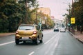 Minsk, Belarus. Renault Sandero Car Of Mustard Colour Moving On Kuybysheva Street In Autumn Day. Royalty Free Stock Photo