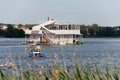 Minsk. Belarus. 08.15.2022. A ship in the form of a two-story houseboat floats along the river.