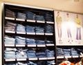 MINSK, BELARUS 4.11.2019: Stylish and high-tech pants jeans are sold on the shelves in the store, background, sale