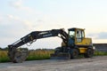 Volvo EW160B wheeled excavator at a construction site