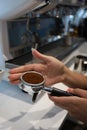 Minsk. Belarus - 06.06.2021: Woman makes aromatic, fresh coffee in a coffee machine.