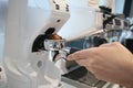 Minsk. Belarus - 06.06.2021: Woman makes aromatic, fresh coffee in a coffee machine.