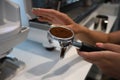 Minsk. Belarus - 06.06.2021: Woman makes aromatic, fresh coffee in a coffee machine.