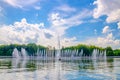 Minsk cityscape with fountain in Svislach or Svislac river and Janka Kupala Park with green trees