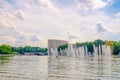 Minsk cityscape with fountain in Svislach or Svislac river, Janka Kupala Park green trees