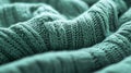 A mint abstract background featuring a fine, knitted pattern, resembling a cozy sweater. The