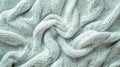 A mint abstract background featuring a fine, knitted pattern, resembling a cozy sweater. The