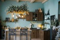 Mint blue kitchen interior and Christmas decor. Cooking dinner at home according to the concept of the kitchen Royalty Free Stock Photo