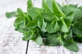 Mint. Bunch of Fresh green organic mint leaf on wooden table closeup. Selective focus. Royalty Free Stock Photo