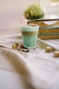 Mint coffee with with cream and colorful decoration. Milk shake, cocktaill, frappuccino. Unicorn coffee, unicorn food. Royalty Free Stock Photo