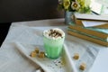 Mint coffee with with cream and colorful decoration. Milk shake, cocktaill, frappuccino. Unicorn coffee, unicorn food.