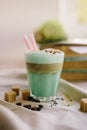 Mint coffee with with cream and colorful decoration. Milk shake, cocktaill, frappuccino. Unicorn coffee, unicorn food.