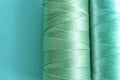 Mint color sewing threads on table