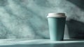 Mint colored coffee cup on textured surface with soft natural light highlighting its contours in a serene setting Royalty Free Stock Photo