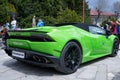 A green Lamborghini car parked on top of a brick floor Royalty Free Stock Photo