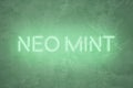 mint colored neon sign lettering on abstract textured background