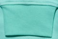 Mint cotton sweater sleeve, close up